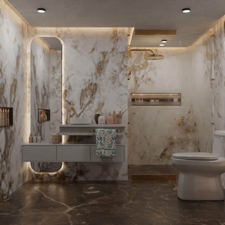 Luxury bathroom finished in large-format veined marble tile with brushed brass fixtures and backlit mirror